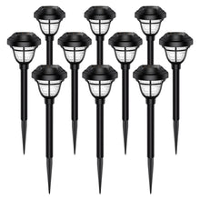 Load image into Gallery viewer, Six warm white solar pathway lights with elegant light-and-shadow patterns illuminating a paved walkway and a classic villa building under the night sky.